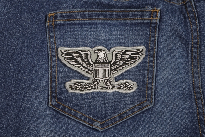 Colonel Eagle Insignia Patch shown on jeans