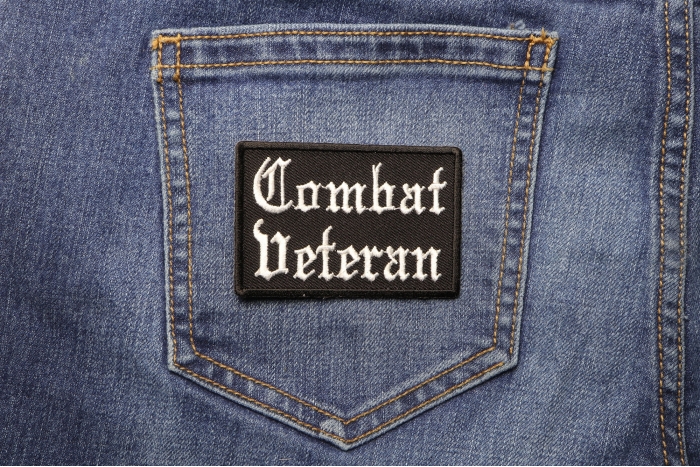 Combat Veteran Patch In Old English shown on jeans
