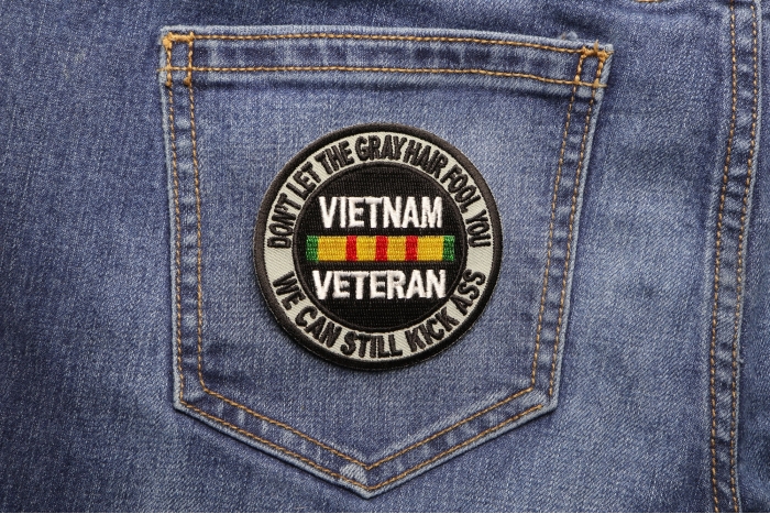 Don't Let The Gray Hair Fool You Vietnam Veteran Patch shown on jeans
