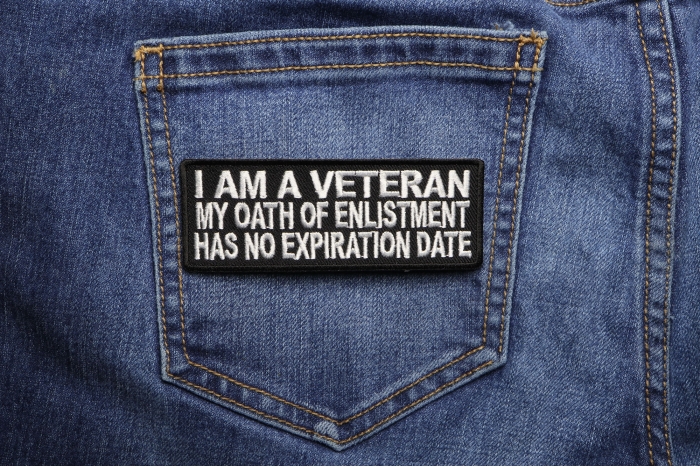 I Am A Veteran My Oath Of Enlistment Has No Expiration Date Patch shown on jeans