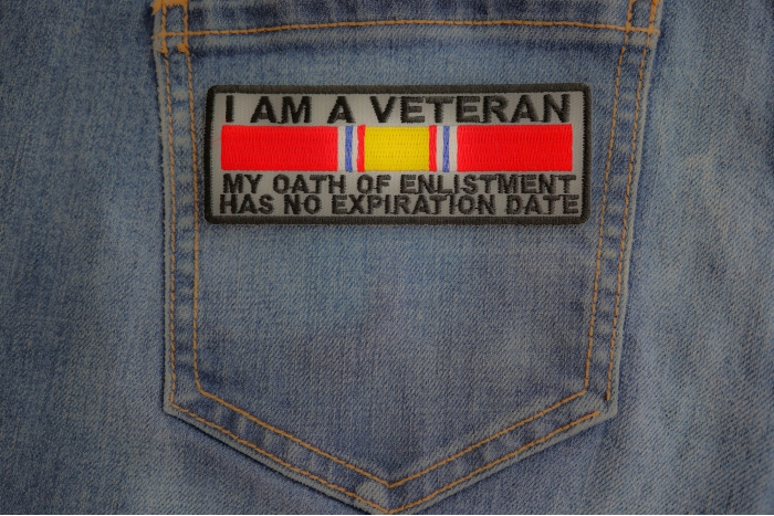 I Am A Veteran My Oath Of Enlistment Has No Expiration Date Patch shown on jeans