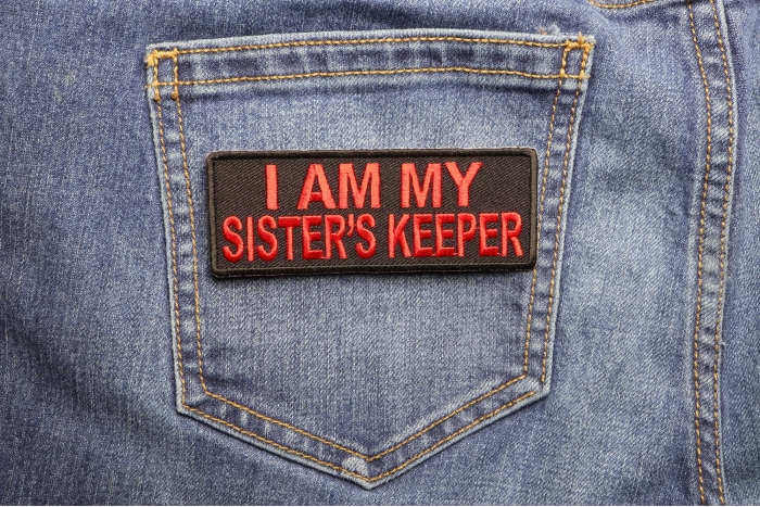 I Am My Sister's Keeper Patch In Red shown on jeans