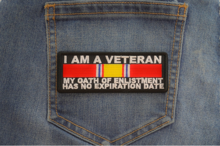 I Am A Veteran My Oath Of Enlistment Has No Expiration Date Patch with National Defense Ribbon shown on jeans