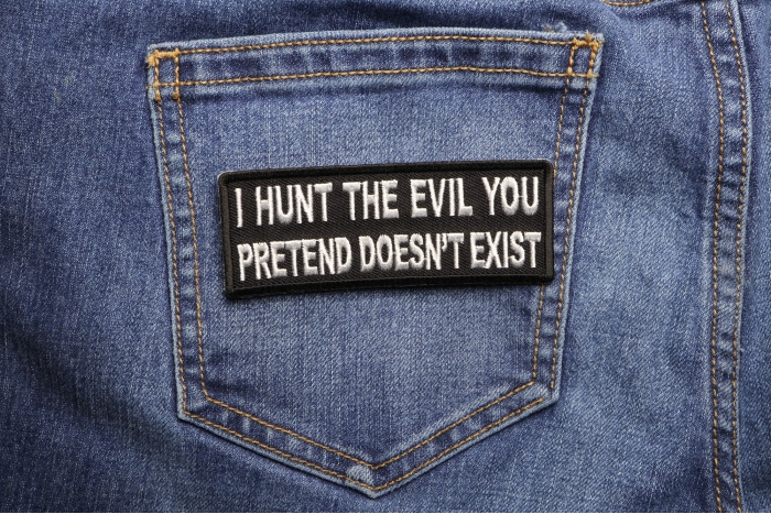 I Hunt the Evil You Pretend Doesn't Exist Military Morale Patch shown on jeans