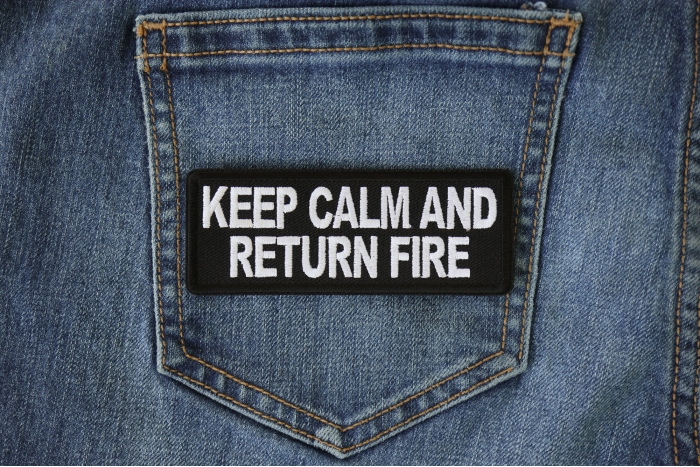 Keep Calm and Return Fire Patch shown on jeans