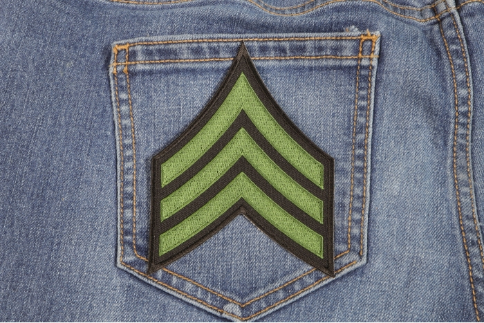 Sergeant Chevron Green Black Patch shown on jeans