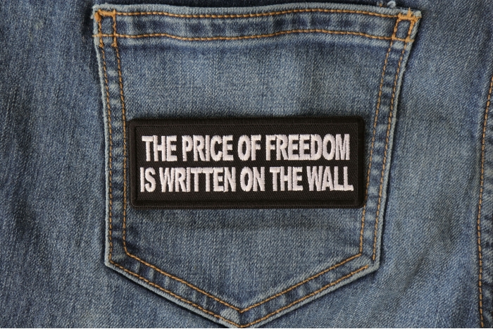 The Price of Freedom is Written on The Wall Patch shown on jeans