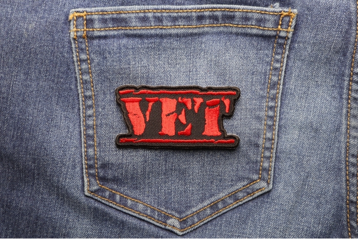 Vet Patch Old Stamper Red shown on jeans