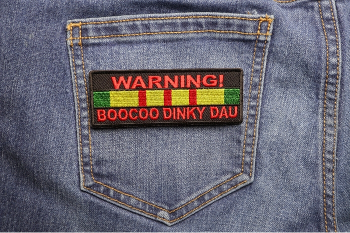 Warning Boocoo Dinky Dau Patch shown on jeans