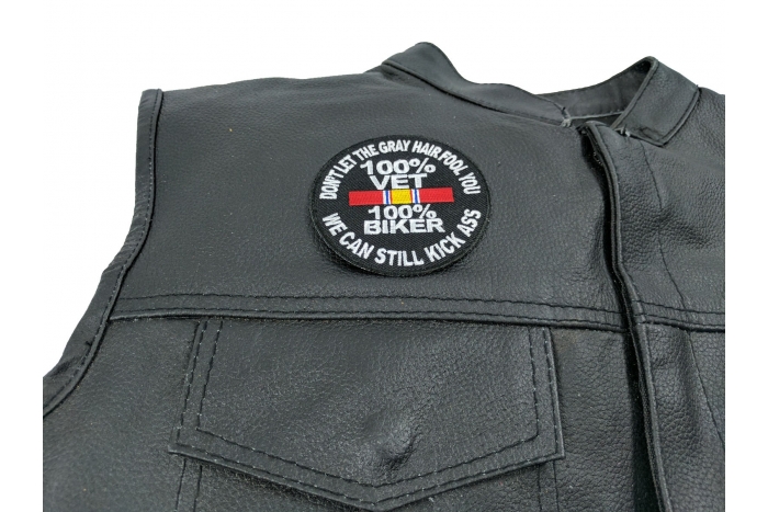100 Percent Vet 100 Percent Biker We Can Still Kick Ass Patch - 3x3 inch. Embroidered Iron on Patch shown on leather vest