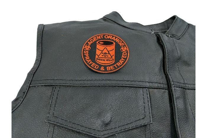Agent Orange Sprayed and Betrayed Patch - 3x3 inch. Embroidered Iron on Patch shown on leather vest