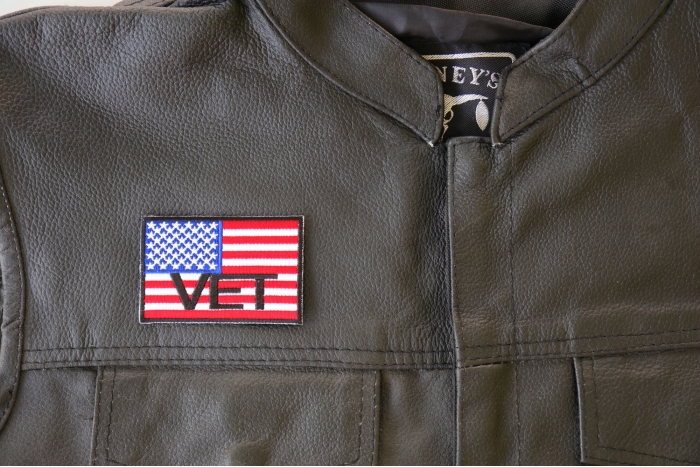 American Flag Vet Patch - 3x2 inch. Embroidered Iron on Patch shown on leather vest