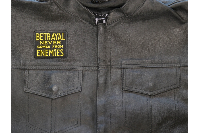 Betrayal Never Comes From Enemies Patch shown on leather vest