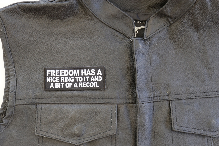 Freedom Has a Nice Ring To It and a Bit of a Recoil Patch, Funny Saying Patches shown on leather vest