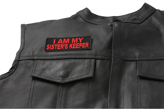 I Am My Sister's Keeper Patch In Red - 4x1.5 inch. Embroidered Iron on Patch shown on leather vest
