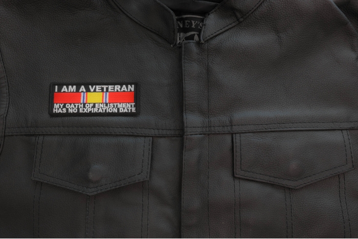 I Am A Veteran My Oath Of Enlistment Has No Expiration Date Patch with National Defense Ribbon, Military Vet Patches shown on leather vest
