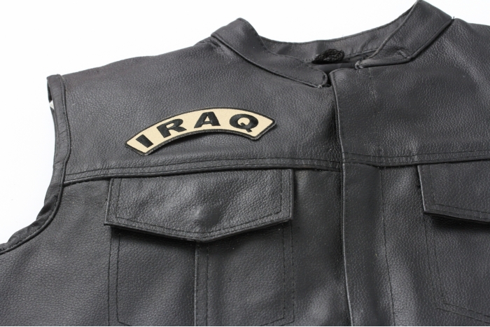 Iraq Small Arm Rocker Patch - 4.5x1.5 inch. Embroidered Iron on Patch shown on leather vest