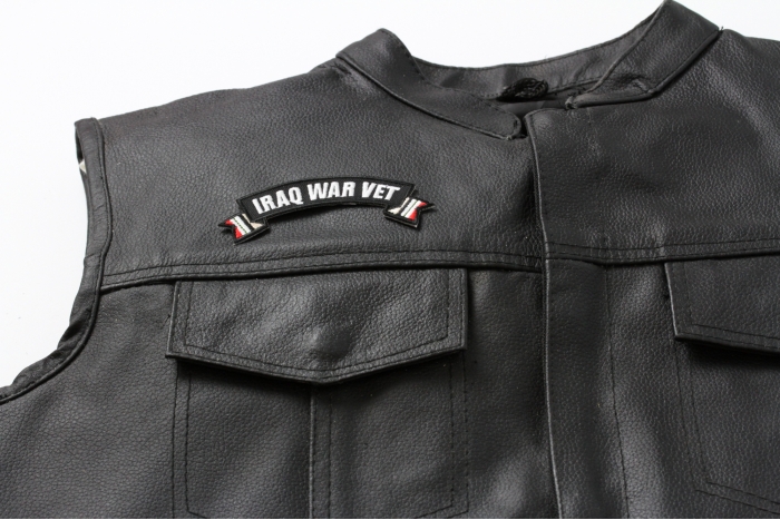 Iraq War Vet Ribbon Small Rocker - 4x1.5 inch. Embroidered Iron on Patch shown on leather vest