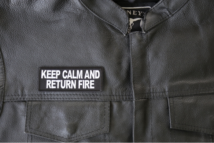 Keep Calm and Return Fire Patch, Military Saying Patches shown on leather vest