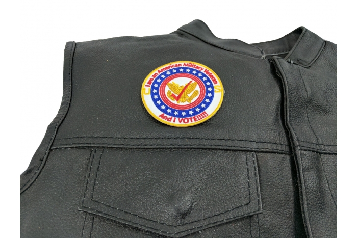 I am an American Military Veteran and I Vote Patch - 3x3 inch. Embroidered Iron on Patch shown on leather vest