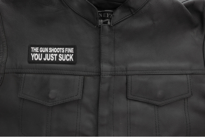 The Gun Shoots Fine You just Suck Patch shown on leather vest