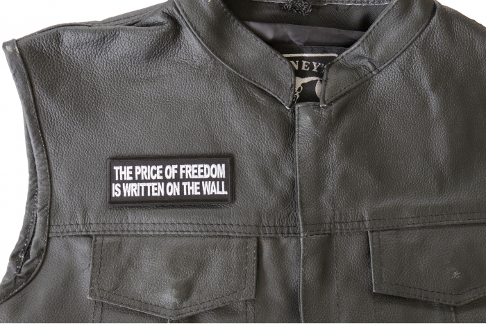 The Price of Freedom is Written on The Wall Patch, Military Saying Patches shown on leather vest
