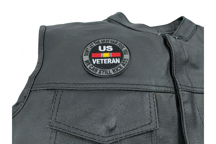 Don't Let The Gray Hair Fool You We Can Still Kick Ass US VETERAN Patch - 3x3 inch. Embroidered Iron on Patch shown on leather vest