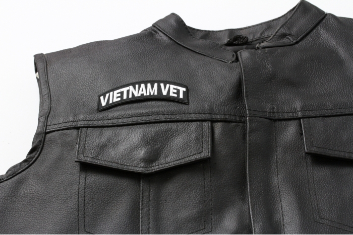 Vietnam Vet Patch White Rocker - 3.75x1.5 inch. Embroidered Iron on Patch shown on leather vest