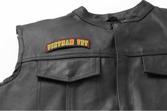 Vietnam Vet Rocker Small Patch - 3.75x1.75 inch. Embroidered Iron on Patch shown on leather vest