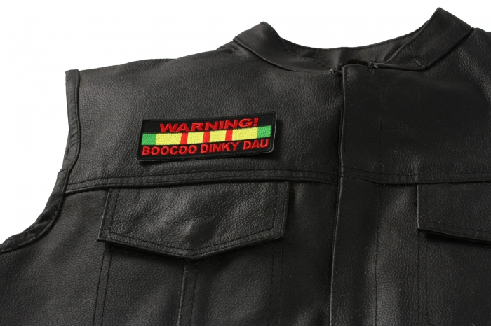 Warning Boocoo Dinky Dau Patch, Military Saying Patches shown on leather vest