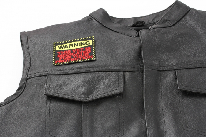 Warning: This Vet Is Medicated For Your Protection Patch - 3x2.5 inch. Embroidered Iron on Patch shown on leather vest