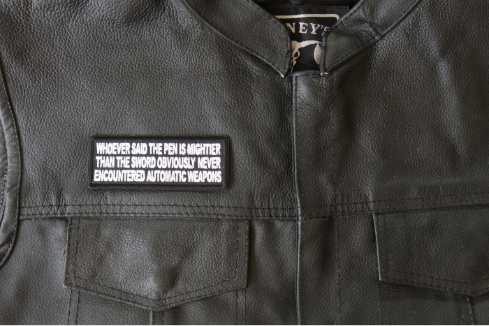 Whoever Said the Pen is Mightier than the Sword Obviously Never Encountered Automatic Weapons Patch - 4x1.5 inch - Embroidered Iron on Patch shown on leather vest
