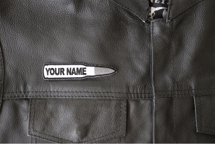 Your Name Bullet Patch - 4x1 inch - Embroidered Iron on Patch shown on leather vest