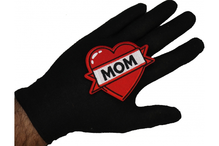 Love Mom Patch shown on hand for size comparison
