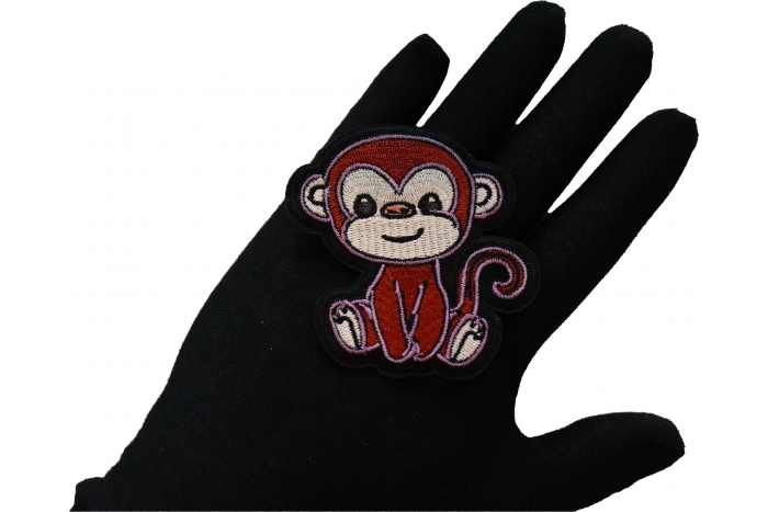 Baby Monkey Iron on Patch shown on hand for size comparison