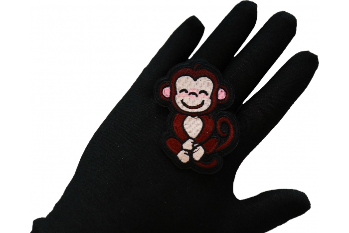 Cute Monkey Iron on Patch shown on hand for size comparison