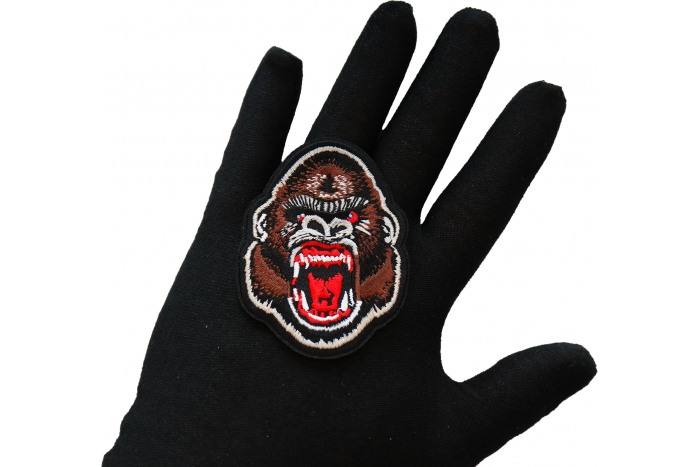 Ugly Monkey Iron on Patch shown on hand for size comparison