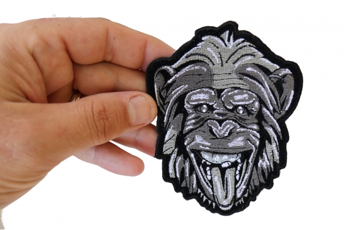 Party animal Monkey Iron on Patch shown on hand for size comparison