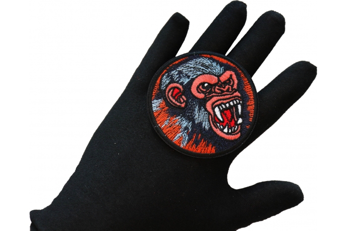 Vicious Chimp Iron on Patch shown on hand for size comparison