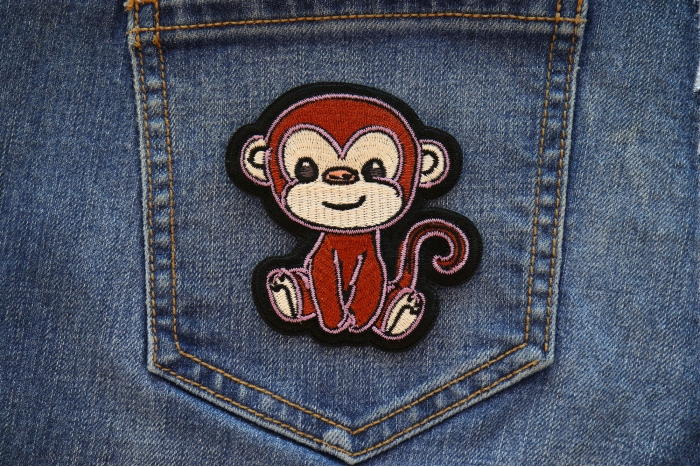 Baby Monkey Iron on Patch shown on jeans