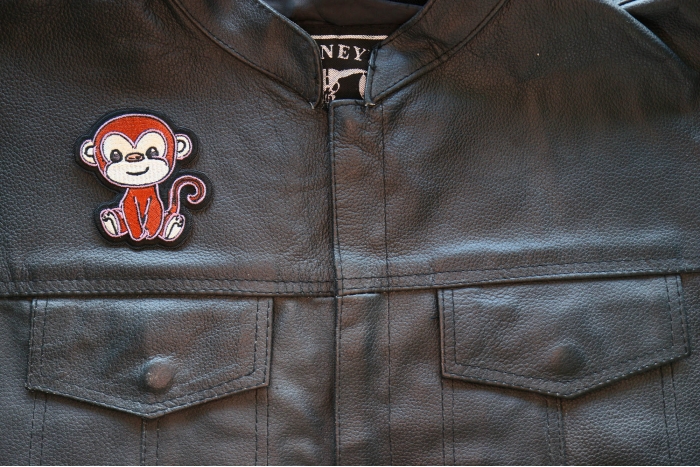 Baby Monkey Iron on Patch shown on leather vest