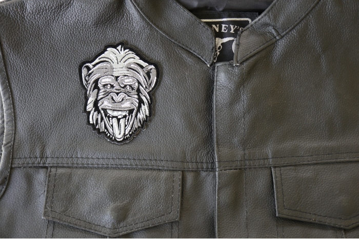 Party Animal Monkey Patch - 3.3x4 inch - Embroidered Iron on Patch shown on leather vest