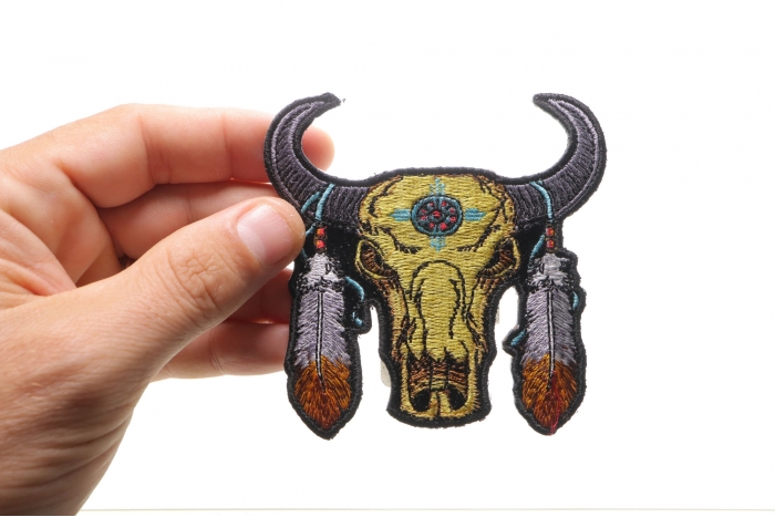 Small Buffalo Head Feathers Patch shown on hand for size comparison