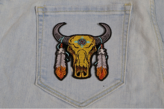 Small Buffalo Head Feathers Patch shown on jeans