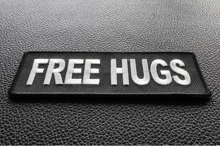 Free Hugs Naughty Iron on Patch diagonal view