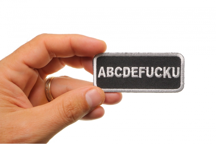 Abcdefucku Patch, Funny Patches for Adults shown on hand for size comparison