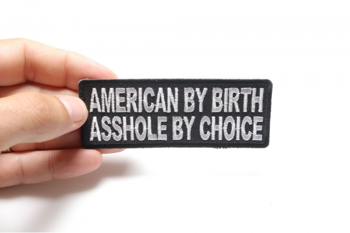 American By Birth Asshole By Choice Naughty Patch shown on hand for size comparison