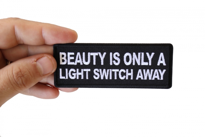 Beauty is Only a Light Switch Away Patch, Funny Saying Patches shown on hand for size comparison