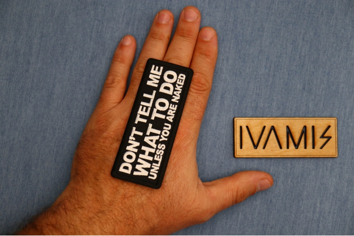 Don't tell me what to do unless you are Naked Patch shown on hand for size comparison