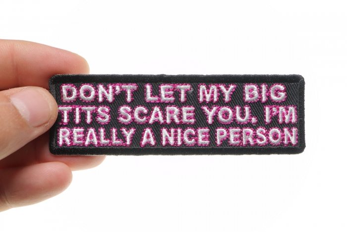 Don't Let My Big Tits Scare You I'm Really A Nice Person Patch, Funny Saying Patches shown on hand for size comparison